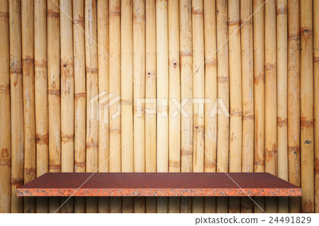 Empty top of natural stone shelves and bamboo wall background Empty top of natural stone shelves and bamboo wall background 24491829