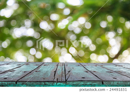 Empty top wooden table and sunny abstract blurred bokeh Empty top wooden table and sunny abstract blurred bokeh 24491831