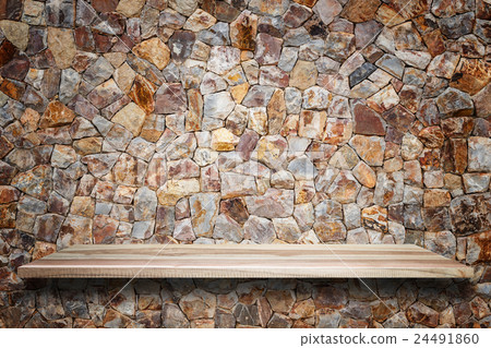 Empty top wooden shelves and stone wall background 24491860