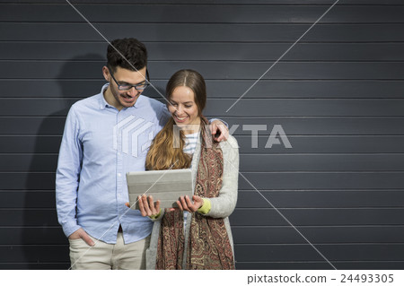 Happy couple using a Digital Tablet. Happy couple using a Digital Tablet. 24493305