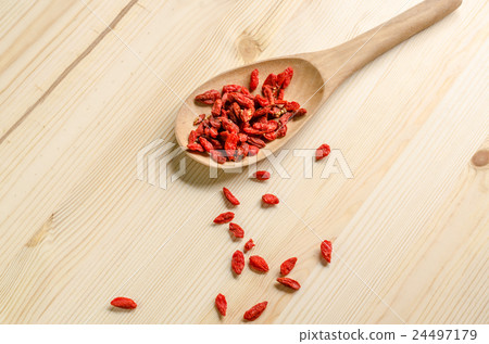 Dried goji berries on wooden tablespoon Dried goji berries on wooden tablespoon 24497179