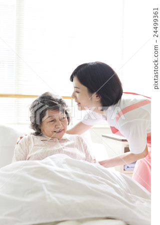 A young caregiver A young caregiver 24499361