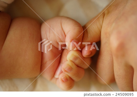 Baby's hand and connection 24509095