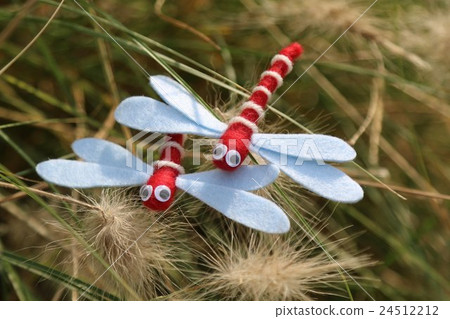 A red dragonfly mascot and Pennetham bilo sam sideways A red dragonfly mascot and Pennetham bilo sam sideways 24512212
