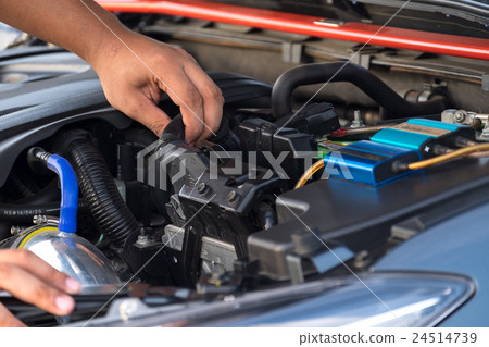 Hand man checking car engine Hand man checking car engine 24514739