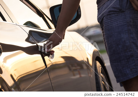 Hand on handle. Close-up of man hand opening a car Hand on handle. Close-up of man hand opening a car 24514742