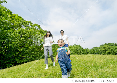 Parents playing in the park of fresh green Parents playing in the park of fresh green 24526828