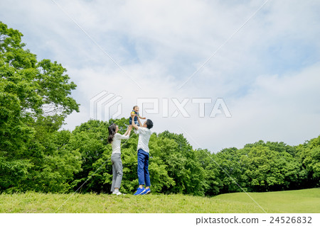 Parents playing in the park of fresh green 24526832