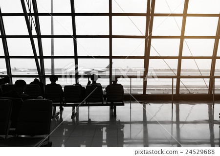 silhouette of passengers waiting for the airplane 24529688