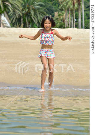 A girl who enjoys swimming 24529771