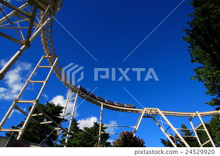 Rollercoaster and blue sky Rollercoaster and blue sky 24529920