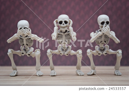 Three skeletons pose as three wise monkey Three skeletons pose as three wise monkey 24533557
