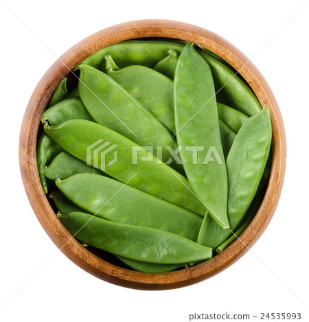 Snow peas in a bowl over white 24535993