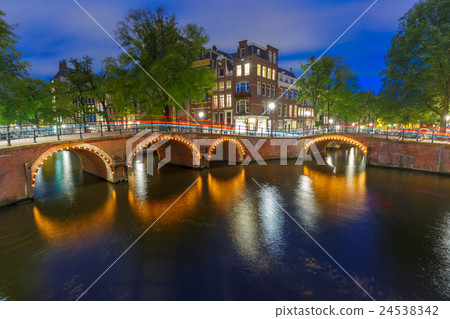 Night city view of Amsterdam canal and bridge 24538342