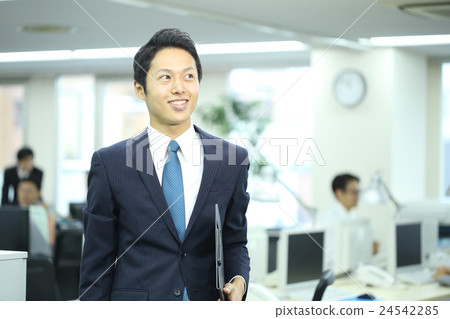 A man working in his 30's A man working in his 30's 24542285