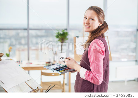 Portrait of a young woman painter drawing with Portrait of a young woman painter drawing with 24550853