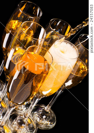 Champagne pour in a glass 24557083