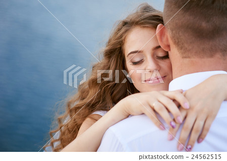 young groom and bride hugging on the background of young groom and bride hugging on the background of 24562515