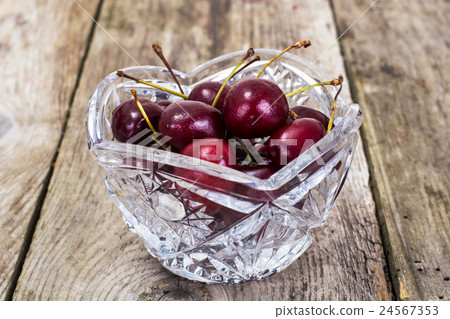Cherries in Crystal Bowl on Rustic Background Cherries in Crystal Bowl on Rustic Background 24567353