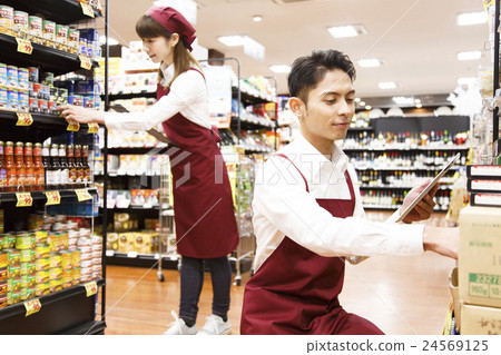 Super supermarket tablet clerk staff male female person retail trade 24569125