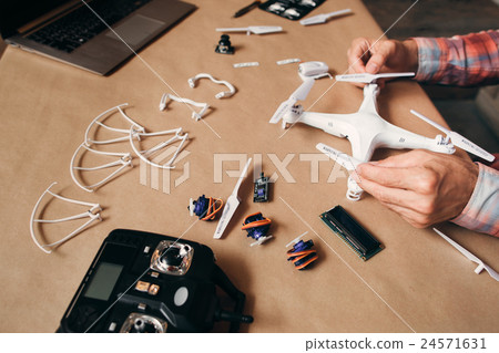 Propellers installing on flying drone, close-up Propellers installing on flying drone, close-up 24571631