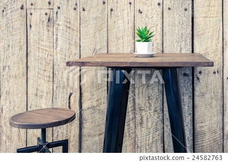 Vintage wooden table with flower in the pot 24582763