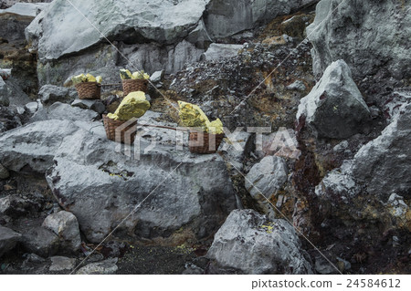 Basket of sulfur nuggets at Kawah Ijen volcano Basket of sulfur nuggets at Kawah Ijen volcano 24584612