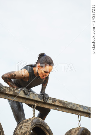 Extrim survival race concept.  Action woman 24587213