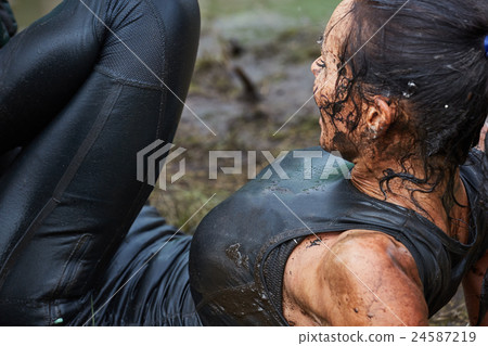 Extrim survival race concept.  Action woman 24587219