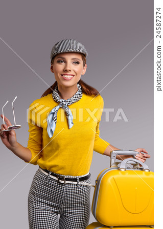 Vintage woman with yellow suitcase. travrel concept Vintage woman with yellow suitcase. travrel concept 24587274