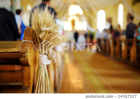 Beautiful rye wedding decoration in a church Beautiful rye wedding decoration in a church 24587527