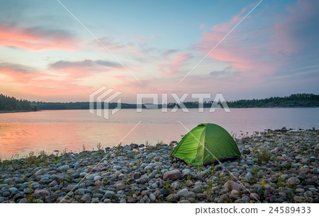 Beautiful sunset view on the calm lake and small Beautiful sunset view on the calm lake and small 24589433