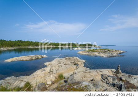 Ladoga lake and small stone islands landscape. Ladoga lake and small stone islands landscape. 24589435