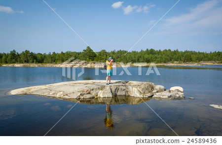 Photographer at the small stone island Photographer at the small stone island 24589436