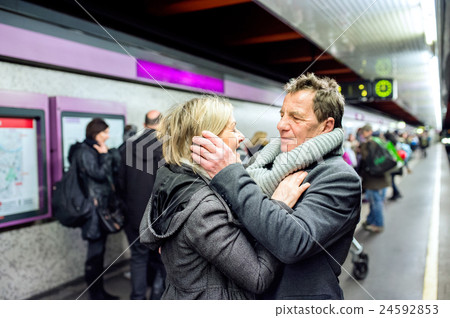 Senior couple standing at the underground platform 24592853