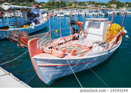Vintage wooden fishing boat moored in port 24593244