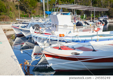 White Greek wooden fishing boats White Greek wooden fishing boats 24593249