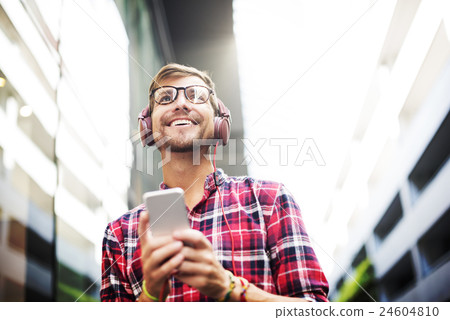 Man Walking Listening Misic Earphones Casual Concept Man Walking Listening Misic Earphones Casual Concept 24604810