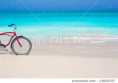 Bike on a tropical beach against the turquoise 24609167