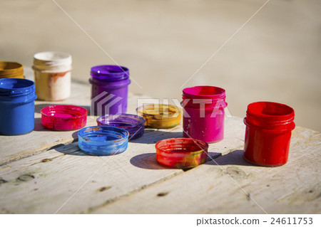 small jars of paint gouache on a wooden table small jars of paint gouache on a wooden table 24611753