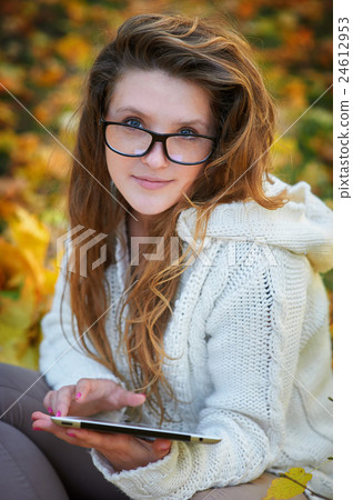 beautiful young woman in glasses with the tablet beautiful young woman in glasses with the tablet 24612953
