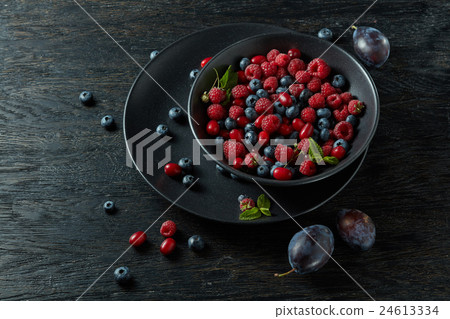 raspberries, blueberries, plum and dogwood. fresh 24613334