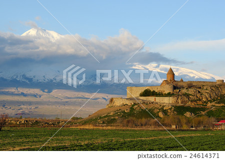 Ancient monastery in front of mountain 24614371