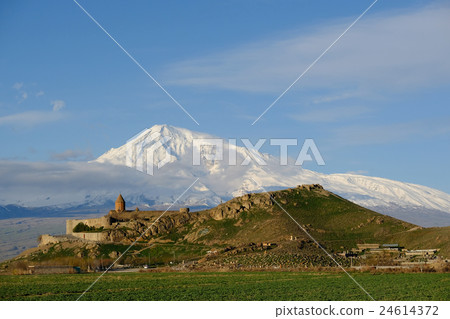 Ancient monastery in front of mountain 24614372