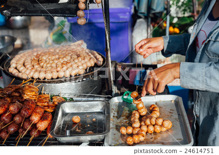 Thai woman cooks meatballs Thai woman cooks meatballs 24614751