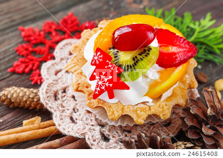 Winter holiday rustic background with fruit tart Winter holiday rustic background with fruit tart 24615408