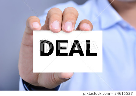 DEAL word on business card shown by a man DEAL word on business card shown by a man 24615527