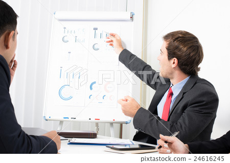 Businessman pointing on the graph in the meeting Businessman pointing on the graph in the meeting 24616245