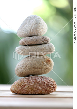 balance rock or zen stones on wooden floor. balance rock or zen stones on wooden floor. 24618666