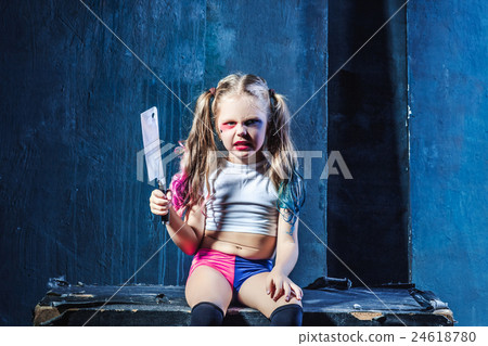 Horror shot: a scary evil girl with bloody knife 24618780